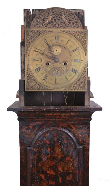 John Green, Skipton, England tall clock, 8 day, time and gong strike, weight driven movement in a chinoiserie oak case with carved coffin top, three quarter columns on hood door and quarter columns on rear of hood on applied molded base. The brass dial has an applied reticulated arch with putti holding a crown, applied cast brass spandrels and calendar and maker
