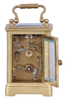 France, for H. Arnold, Budapest, a miniature carriage timepiece with alarm, mignonette #1 size Obis case with beveled glasses, Arabic numeral white enamel dial, blued steel hands, 8 day brass movement with lever platform, the alarm sounding on a coiled gong concealed in the base