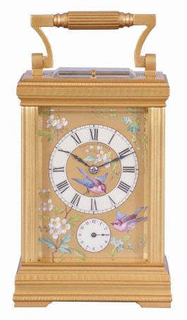 France, for Theodore B. Starr, New York, a large, decorative carriage clock with polychrome enamel decoration and grand sonnerie striking, the Anglaise variant case set with beveled glasses and gilt, porcelain panels, each decorated with flying and perching birds among flowering vines and branches, the dial with Roman numeral white enamel chapter, on a decorative panel matching the case sides, blued steel distaff hands, 8 day time, strike, and alarm movement with lever platform, sounding grand or petit quarters in passing, and repeating the last hour and quarter on demand, serial #1330