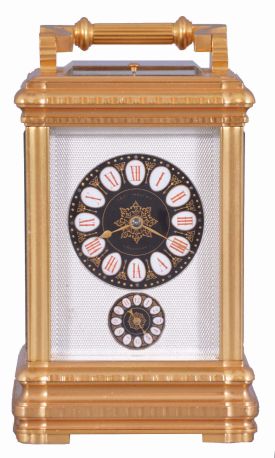 Margaine, Paris, for J.E. Caldwell, Philadelphia, a large and decorative striking carriage clock, the gilt Gorge variant case set with beveled glasses, engine turned silvered dial mask surrounding the time and alarm displays, each with gilt decorated black ground, and with convex, white, egg shaped reserves for the red Roman and Arabic numerals, gold spade and poker hands, 8 day time, strike and alarm movement with lever platform, repeating the last hour on demand, the back plate with Margaine
