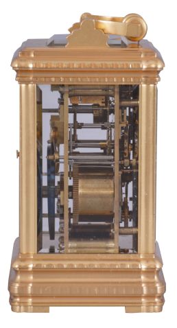 Margaine, Paris, for J.E. Caldwell, Philadelphia, a large and decorative striking carriage clock, the gilt Gorge variant case set with beveled glasses, engine turned silvered dial mask surrounding the time and alarm displays, each with gilt decorated black ground, and with convex, white, egg shaped reserves for the red Roman and Arabic numerals, gold spade and poker hands, 8 day time, strike and alarm movement with lever platform, repeating the last hour on demand, the back plate with Margaine