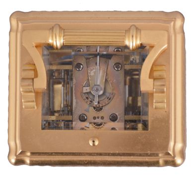 Margaine, Paris, for J.E. Caldwell, Philadelphia, a large and decorative striking carriage clock, the gilt Gorge variant case set with beveled glasses, engine turned silvered dial mask surrounding the time and alarm displays, each with gilt decorated black ground, and with convex, white, egg shaped reserves for the red Roman and Arabic numerals, gold spade and poker hands, 8 day time, strike and alarm movement with lever platform, repeating the last hour on demand, the back plate with Margaine