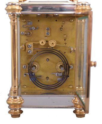 Jules Desjardin, France, carriage clock, time, strike, repeat & alarm, in a two-tone round column case, with round white dials behind a frosted gilt mask with the Arabic numerals separated by gold stars at the half hour positions. 18462