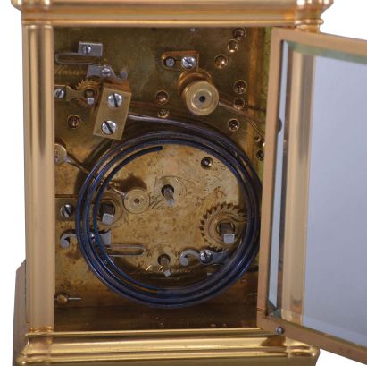 France, Carriage Clock, Grand Sonnerie, and repeat, with alarm, in a gilt gorge case, serial 5581, 8 day, lever escapement silvered platform escapement, case with cream colored dials, top dial signed J. E. Caldwell & Co. against a gilt mask, Philadelphia- Paris.