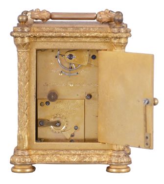 Aubert & Klaftenberger, London, a fine, small, week going English carriage timepiece, the gilt case with foliate engraving, the corners with chased, leaf decorated columns, and signed "L. Lange", Roman numeral silvered dial, the center also with engraving matching the case, blued steel Breguet style hands, and 8 day, 6 pillar fusee movement with lever escapement, serial #1061.