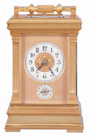 France, a large, Anglaise cased carriage clock with grand sonnerie striking, the glazed, gilt case with molded top and base, the corners with fluted pilasters, Arabic numeral white enamel dial with gilt center and mask, blued steel distaff hands, 8 day time, strike, and alarm movement with lever platform, sounding grand or petit quarters in passing, and repeating the last hour and quarter on demand
