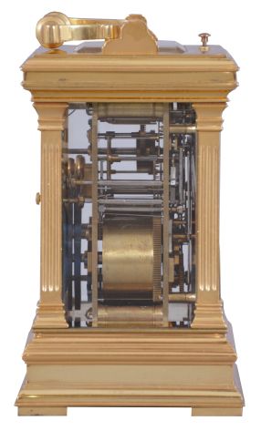 France, a large, Anglaise cased carriage clock with grand sonnerie striking, the glazed, gilt case with molded top and base, the corners with fluted pilasters, Arabic numeral white enamel dial with gilt center and mask, blued steel distaff hands, 8 day time, strike, and alarm movement with lever platform, sounding grand or petit quarters in passing, and repeating the last hour and quarter on demand