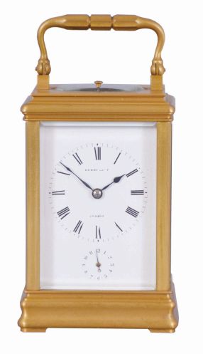 Margaine, Paris, for Henry Capt, Geneva, a Cannelee cased hour repeating carriage clock, glazed, gilt case with molded top and base, signed Roman numeral white enamel dial, blued steel spade and poker hands, 8 day time, strike, and alarm movement with lever platform, repeating the last hour on demand, the back plate with Margaines mark