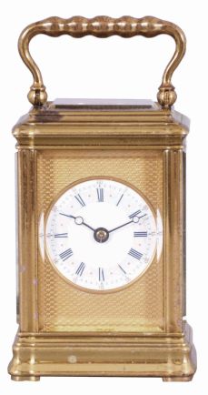 Breguet, Paris, a 3/4 size striking carriage clock, glazed brass Gorge case, white enamel dial with blue Roman numerals on a gray ground, with gold, Arabic numeral, outer five minute markers, blued steel Breguet style hands, and with engine turned, gilt mask, the top glass also backed with a matching, engine turned plate with oval aperture for viewing the escapement, 8 day, two train movement with lever platform and cut bimetallic balance, striking the hour and half hour on a bell, serial #1316