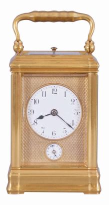 Margaine, Paris, a 3/4 size, Gorge cased hour repeating carriage clock with original outer box, gilt case with beveled glasses, Arabic numeral white enamel dial with gilt, engine turned mask, blued steel hands, 8 day time, strike and alarm movement with lever platform and cut bimetallic balance, repeating the last hour on demand, the back plate with Margaine