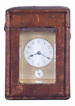 Margaine, Paris, a 3/4 size, Gorge cased hour repeating carriage clock with original outer box, gilt case with beveled glasses, Arabic numeral white enamel dial with gilt, engine turned mask, blued steel hands, 8 day time, strike and alarm movement with lever platform and cut bimetallic balance, repeating the last hour on demand, the back plate with Margaine
