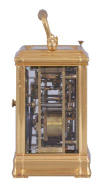 Margaine, Paris, a 3/4 size, Gorge cased hour repeating carriage clock with original outer box, gilt case with beveled glasses, Arabic numeral white enamel dial with gilt, engine turned mask, blued steel hands, 8 day time, strike and alarm movement with lever platform and cut bimetallic balance, repeating the last hour on demand, the back plate with Margaine