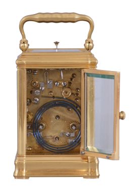 Margaine, Paris, a 3/4 size, Gorge cased hour repeating carriage clock with original outer box, gilt case with beveled glasses, Arabic numeral white enamel dial with gilt, engine turned mask, blued steel hands, 8 day time, strike and alarm movement with lever platform and cut bimetallic balance, repeating the last hour on demand, the back plate with Margaine