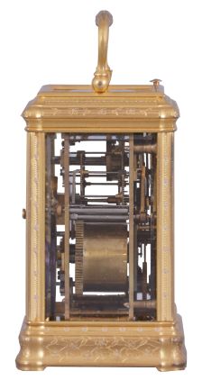 Drocourt, for Tiffany, Reed & Cie, Paris, a Gorge cased, hour repeating carriage clock with cold painted enamel ornament, gilt case with floral engraving and mauve accents, Roman numeral white enamel dial with engraved, gilt mask, also enhanced with mauve colored cold enamel, blued steel Breguet style hands, 8 day time, strike, and alarm movement with lever platform, repeating the last hour on demand, the back plate with the mark of Drocourt, serial #11150
