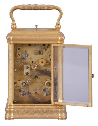 Drocourt, for Tiffany, Reed & Cie, Paris, a Gorge cased, hour repeating carriage clock with cold painted enamel ornament, gilt case with floral engraving and mauve accents, Roman numeral white enamel dial with engraved, gilt mask, also enhanced with mauve colored cold enamel, blued steel Breguet style hands, 8 day time, strike, and alarm movement with lever platform, repeating the last hour on demand, the back plate with the mark of Drocourt, serial #11150