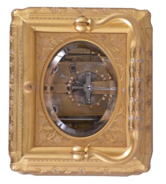 Drocourt, for Tiffany, Reed & Cie, Paris, a Gorge cased, hour repeating carriage clock with cold painted enamel ornament, gilt case with floral engraving and mauve accents, Roman numeral white enamel dial with engraved, gilt mask, also enhanced with mauve colored cold enamel, blued steel Breguet style hands, 8 day time, strike, and alarm movement with lever platform, repeating the last hour on demand, the back plate with the mark of Drocourt, serial #11150