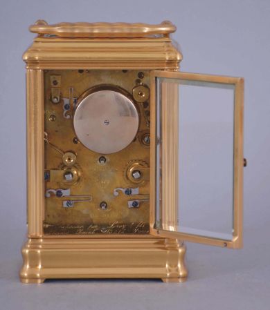 Leroy & Fils, Paris, a good, Gorge cased hour repeating carriage clock with alarm, gilt, glazed case with carrying handle, signed Roman numeral white enamel dial, bearing the firms addresses in Paris and London, blued steel Breguet style hands, 8 day time, strike and alarm movement with lever platform, and repeating the last hour on demand, the back plate marked "Repassee par Leroy & Fils Palais Royal 13 & 15, Paris", and also with the mark of Drocourt, serial #8909