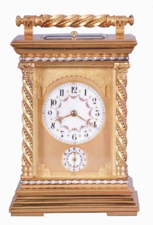 France, a large and unusual hour repeating carriage clock, the glazed, gilt case with stepped base, corners with twisted, beaded columns, the top with carrying handle of the same design as the columns, smaller twist and bead silvered bands above base and below cornice, Arabic numeral white enamel dials decorated with floral garlands and with double gilt mask, the outer portion fretted and engraved, the inner matted, gold fleur de lis hands, 8 day time, strike, and alarm movement with lever platform and cut bimetallic balance, serial #133