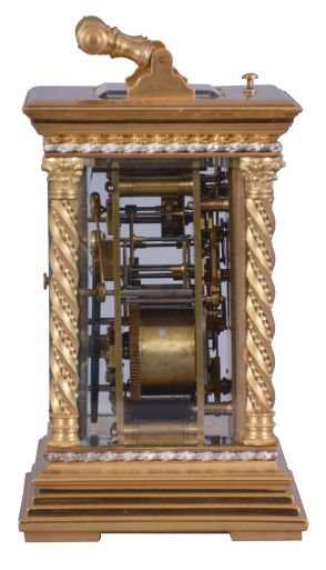 France, a large and unusual hour repeating carriage clock, the glazed, gilt case with stepped base, corners with twisted, beaded columns, the top with carrying handle of the same design as the columns, smaller twist and bead silvered bands above base and below cornice, Arabic numeral white enamel dials decorated with floral garlands and with double gilt mask, the outer portion fretted and engraved, the inner matted, gold fleur de lis hands, 8 day time, strike, and alarm movement with lever platform and cut bimetallic balance, serial #133