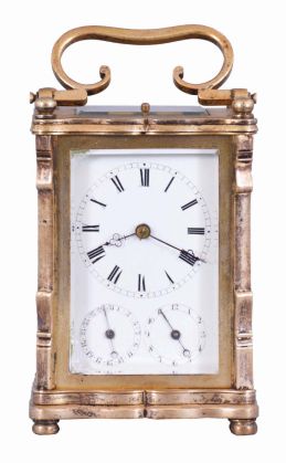 Austria, an unusual three train carriage clock with Viennese striking, date, and alarm, gilt case with corbelled pilasters, top and base with cupids bow molded edges, case back with shuttered apertures for winding and setting, Roman numeral white enamel dial with date and alarm chapters, blued steel trefoil hands, 30 hour time, strike, and alarm movement with cylinder platform, grand sonnerie striking, and repeating the last hour and quarter on demand
