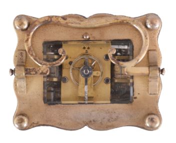 Austria, an unusual three train carriage clock with Viennese striking, date, and alarm, gilt case with corbelled pilasters, top and base with cupids bow molded edges, case back with shuttered apertures for winding and setting, Roman numeral white enamel dial with date and alarm chapters, blued steel trefoil hands, 30 hour time, strike, and alarm movement with cylinder platform, grand sonnerie striking, and repeating the last hour and quarter on demand