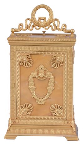 Ed. Chartier, Paris, for Tiffany & Co., New York, a fine gilt bronze and sienna marble carriage clock in the neoclassical style, the case set with five stone panels, within leaf molded surrounds having anthemion corners, the front with Roman numeral white enamel dial and gilt hands, above horn of plenty and lyre ornament, the case sides set with a single, dancing muse, and the top with carrying handle of bowknot and trailing ribbon form, with central laurel wreath, 8 day time, strike, and alarm movement with lever platform, repeating the last hour on demand, serial #12837, case and movement signed by Chartier