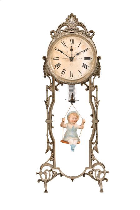 Ansonia Clock Co., New York, "Jumper No. 2" bobbing doll novelty timepiece, 30 hour, time only, spring driven movement that powers the clock and bouncing bisque doll, cast metal stand, 4 inch paper dial.