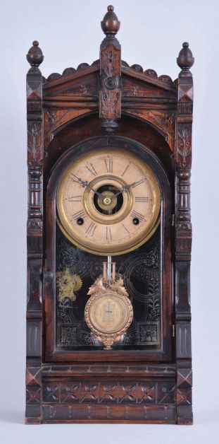 F. Kroeber Clock Co., New York, "Langtry" parlor clock, 8 day, time and strike with alarm, spring driven with walnut case, paper dial, and fancy regulating pendulum.