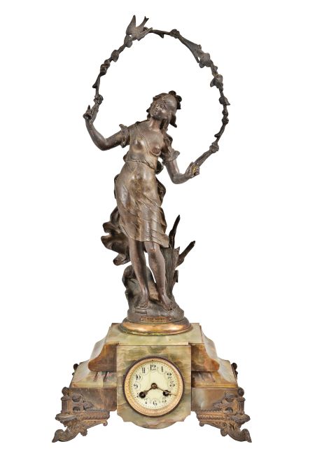France, Green Onyx Figural Clock, with cream colored arabic numeral dial set within a brass bezel with beveled glass, patinated spelter young lady figure titled "Doux Retour" or Sweet Return celebrating the annual rite of spring with the figure holding a garland of flowers with a perched bird standing above the dial, green onyx multi-part case on cast and gilt classical feet, round eight day French time and strike, spring powered movement with coiled gong for hour strike and pendulum.