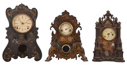 Clocks- 9 (Nine): (1) American iron front case (no movement) c1860; (2) American iron front shelf clock with a spring driven, 8 day timepiece movement, c1860. (3) American iron front shelf clock with a 30 hour timepiece movement and a "Mermaid Times" label on the case bottom, c1860. (4) Forestville Mfg. Co., Forestville, Conn shelf clock with an 8 day spring driven time and strike movement in a wooden case with gilt design and MOP inlay, c1860. (5) A. S. Platt & Co., Bristol, Conn. iron front (painted with MOP inlay) shelf clock with a spring driven 30 hour time and strike movement, c1860. (6) Waterbury Clock Co., 4 Courtland St., New York, painted iron front shelf clock with a 30 hour time and strike movement, c1860. (7) Unmarked American iron front (painted) shelf clock with a 30 hour time & strike spring driven movement, c1860. (8) F. Kroeber Clock Co., New York, iron front shelf clock with a spring driven 30 hour time and strike movement, c1865. (9) Upson Brothers, Bristol, Conn. iron front beehive shelf clock (paint and MOP inlay) with a spring driven, 8 day, time and strike movement (Morse No. (1), c1855