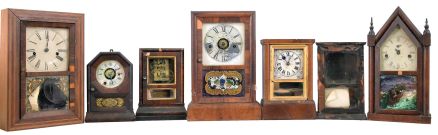 Clocks- 7 (Seven): (1) Elisha Manross, Bristol, shelf clock with a spring driven 30 hour time and strike movement in a rosewood veneered case with inlay, c1850; (2) Seth Thomas, Plymouth Hollow, Conn., cottage shelf clock with a spring driven 30 hour time and alarm movement in a rosewood veneered case, c1850. (3): Brewster & Co., Bristol, Conn., cottage shelf clock with a spring driven 30 hour time and alarm movement in a rosewood veneered case, c1850. (4) Seth Thomas, Plymouth Hollow, Conn., cottage shelf clock with a spring driven 30 hour time and strike movement in a rosewood veneered case, c1850. (5) Daniel Pratt, Reading, Mass., cottage clock with a spring driven 30 hour timepiece movement in a rosewood veneered case, c1855. (6) S. B. Terry, Terryville, Conn., shelf clock with a 30 hour timepiece movement (incomplete) in a paper finished case, c1850. (7) Waterbury Clock Co., Waterbury, Conn. steeple shelf clock with a spring driven 30 hour time and strike case in a mahogany veneered case, c 1855.
