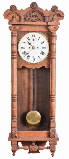 New Haven Clock Co., New Haven, Conn., "Elfrida" hanging clock with a spring driven 30 day timepiece movement in an oak case.
