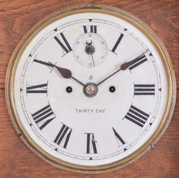 New Haven Clock Co., New Haven, Conn., "Elfrida" hanging clock with a spring driven 30 day timepiece movement in an oak case.