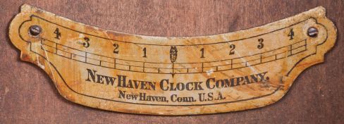New Haven Clock Co., New Haven, Conn., "Elfrida" hanging clock with a spring driven 30 day timepiece movement in an oak case.