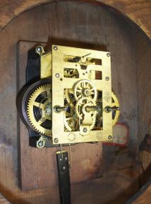 New Haven Clock Co., New Haven, Conn., "Elfrida" hanging clock with a spring driven 30 day timepiece movement in an oak case.