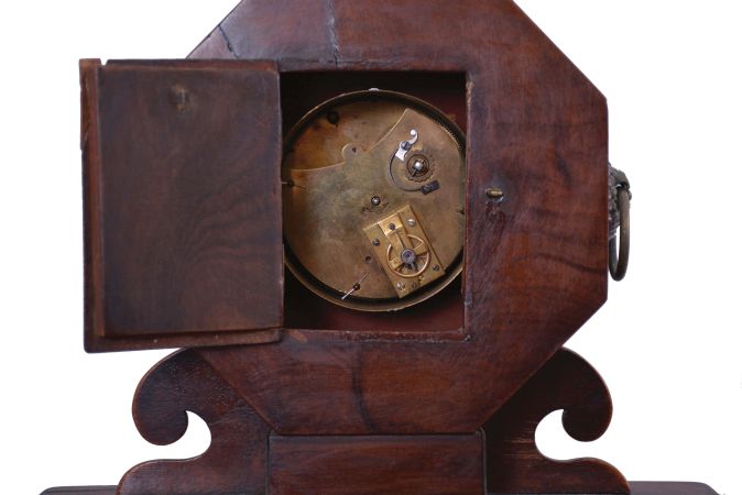 France, mantel clock, 8 day, time only, sping-driven movement with a cylinder escapement in a mahogany case with brass inlay on ball feet supporting a box with drawer that opens to the side, topped with an octagonal head holding a white paper dial with Roman numerals and metal finial.