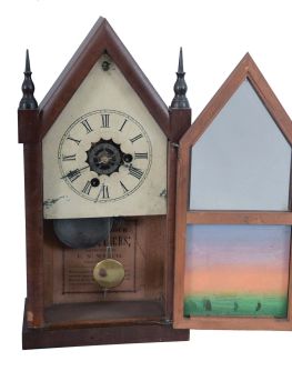 E. N. Welch Mfg. Co., Forestville, Conn. miniature steeple shelf clock with a spring driven 30 hour time and alarm movement in a mahogany veneered case.