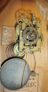 E. N. Welch Mfg. Co., Forestville, Conn. miniature steeple shelf clock with a spring driven 30 hour time and alarm movement in a mahogany veneered case.