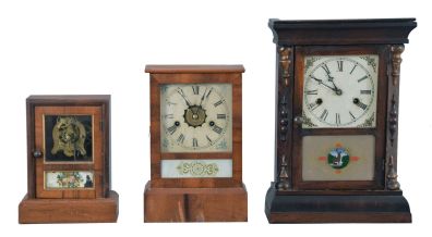 Clocks- 6 (Six): (1) Seth Thomas Clock Co., Thomaston, Conn., "Cottage Extra" shelf clock with a spring driven, 8 day, time and strike movement in a rosewood veneered case; (2) E. N. Welch, Forestville, Conn., cottage shelf clock with a 30 hour timepiece movement in a rosewood veneered case. (3) Waterbury Clock Co., Waterbury, Conn., cottage shelf clock with a spring driven 30 hour time and strike movement in a rosewood veneered case. (4) Seth Thomas Clock Co., Thomaston, Conn., cottage shelf clock with a spring driven 30 hour time and alarm movement in a rosewood veneered case. (5) Jerome & Co., New Haven, Conn., "Cottage No. 2" shelf clock with a spring driven 30 hour time, strike and alarm movement in a veneered case. (6): Gilbert Clock Co., Winsted, Conn., cottage shelf clock with a spring driven 30 hour time and strike movement in a rosewood veneered case.
