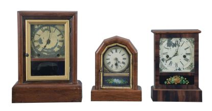 Clocks- 6 (Six): (1) Seth Thomas Clock Co., Thomaston, Conn., "Cottage Extra" shelf clock with a spring driven, 8 day, time and strike movement in a rosewood veneered case; (2) E. N. Welch, Forestville, Conn., cottage shelf clock with a 30 hour timepiece movement in a rosewood veneered case. (3) Waterbury Clock Co., Waterbury, Conn., cottage shelf clock with a spring driven 30 hour time and strike movement in a rosewood veneered case. (4) Seth Thomas Clock Co., Thomaston, Conn., cottage shelf clock with a spring driven 30 hour time and alarm movement in a rosewood veneered case. (5) Jerome & Co., New Haven, Conn., "Cottage No. 2" shelf clock with a spring driven 30 hour time, strike and alarm movement in a veneered case. (6): Gilbert Clock Co., Winsted, Conn., cottage shelf clock with a spring driven 30 hour time and strike movement in a rosewood veneered case.