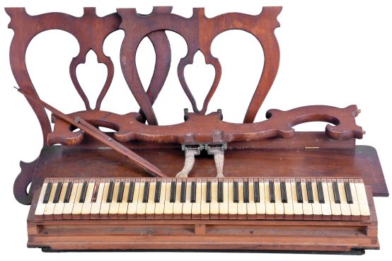 A. G. Marston, Campello, Massachusetts, 5 octave lyre-leg melodeon in a rosewood case. Also included is a second reed organ keyboard of roughly the same size and manufacture with a set of walnut legs.
