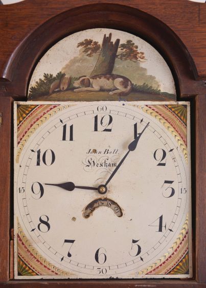John Bell, Hexham, England, 30 hour, time and bell strike, single weight driven movement, c. 1830, in an American walnut case with three brass finials and painted metal dial