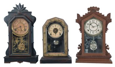 Clocks- 6 (Six): (1) E. Ingraham & Co.,Bristol, Conn., "Venetian" shelf clock with a spring driven, 8 day, time and strike movement in a rosewood veneered case, c1875; (2) E. Ingraham Clock Co., Bristol, Conn., "Halcyon" shelf clock with a spring driven, 8 day, time and strike movement in a walnut case, c1881. (3) Unmarked shelf clock with a spring driven, 8 day, time and strike movement in a celluloid covered case. (4) E. Ingraham & Co., Bristol, Conn., Phoenix shelf clock with a spring driven, 8 day, time and strike movement in a walnut case, c1881. (5) E. Ingraham & Co., Bristol, Conn., "Era" shelf clock with a spring driven, 8 day time, strike and alarm movement in a rosewood veneered case with putty grained front, c1883, (6) Waterbury Clock Co., Waterbury, Conn. unidentified shelf clock with a spring driven, 8 day, time and strike movement in a walnut case, c1890.
