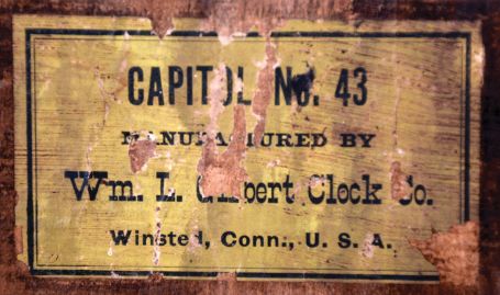 Clocks- 5 (Five): (1) William L. Gilbert Clock Co., Winsted, Conn., "Capital No. 43", case only; (2) New Haven Clock Co., New Haven, Conn., 30 hour, time and strike, spring brass movement Sharp Gothic or steeple clock c1860 (3) William L. Gilbert Clock Co., Winsted, Conn., 8 day, time, strike and alarm spring brass movement shelf clock, c1870 (4) Seth Thomas Clock Co., Thomaston, Conn. 8 day, time and strike, spring brass movement round top shelf clock, c1875 (5) Ansonia Brass & Copper Co., Ansonia, Conn., 8 day, time and strike, spring brass movement shelf clock. 1860