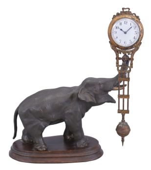 Germany, Junghans, elephant figure, swinging arm novelty clock, patinated figure on a molded wooden base, 8 day.