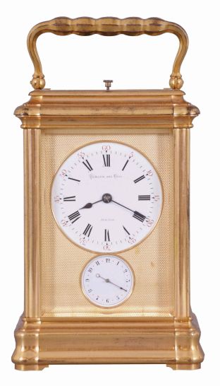 Drocourt, Paris, for Hamann & Koch, New York, an impressive, Gorge cased, grand sonnerie striking giant carriage clock, the massive gilt case with bevelled glasses, the top glass with engine turned mask with an oval aperture for viewing the escapement, Roman numeral white enamel dial also with gilt, engine turned mask, blued steel spade hands, 8 day time, strike, and alarm movement with large lever platform and cut, bimetallic balance, sounding grand or petit quarters in passing, and repeating the last hour and quarter on demand, the front plate marked "H.L.", gong bases marked "F.D." within an oval, serial #1813