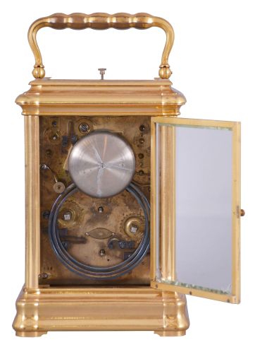 Drocourt, Paris, for Hamann & Koch, New York, an impressive, Gorge cased, grand sonnerie striking giant carriage clock, the massive gilt case with bevelled glasses, the top glass with engine turned mask with an oval aperture for viewing the escapement, Roman numeral white enamel dial also with gilt, engine turned mask, blued steel spade hands, 8 day time, strike, and alarm movement with large lever platform and cut, bimetallic balance, sounding grand or petit quarters in passing, and repeating the last hour and quarter on demand, the front plate marked "H.L.", gong bases marked "F.D." within an oval, serial #1813