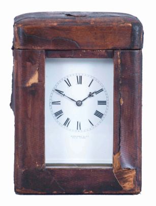 France, for Tiffany & Co., New York, a rare five minute repeating carriage clock, glazed Corniche case, signed Roman numeral white enamel dial, blued steel hands, 8 day, time and strike movement with lever platform and cut bimetallic balance, counting the hours in passing, and repeating the last hour and five minute interval on demand, together with its leather covered wooden travel case