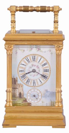 France, for the English market, a fine Pillars style repeating carriage clock with porcelain panels by Lucien Simonnet, the gilt case with stepped, molded base, the corners with fluted columns and Corinthian capitals supporting the molded cornice, the folding handle with turned ornament, case sides set with signed, polychrome enamel scenes depicting colorfully dressed young women in a garden, the Roman numeral dial surrounded by a landscape scene with castle ruins and floral garlands, blued steel distaff hands, 8 day time, strike, and alarm movement with lever platform, and repeating the last hour on demand, serial #2277