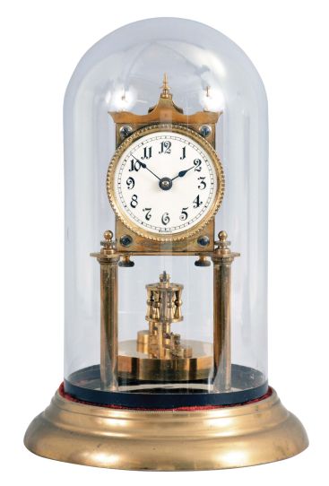 Germany, 400 day or anniversary clock, spring driven, torsion pendulum movement with disc pendulum in a polished brass case with cream porcelain dial under glass dome.